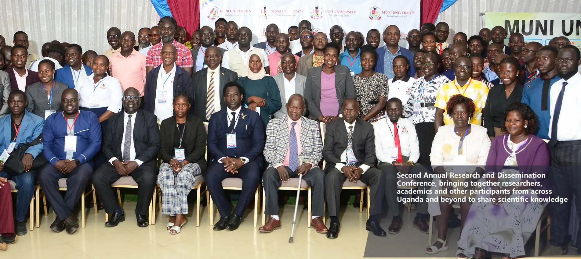 Muni University staff and participants at a conference