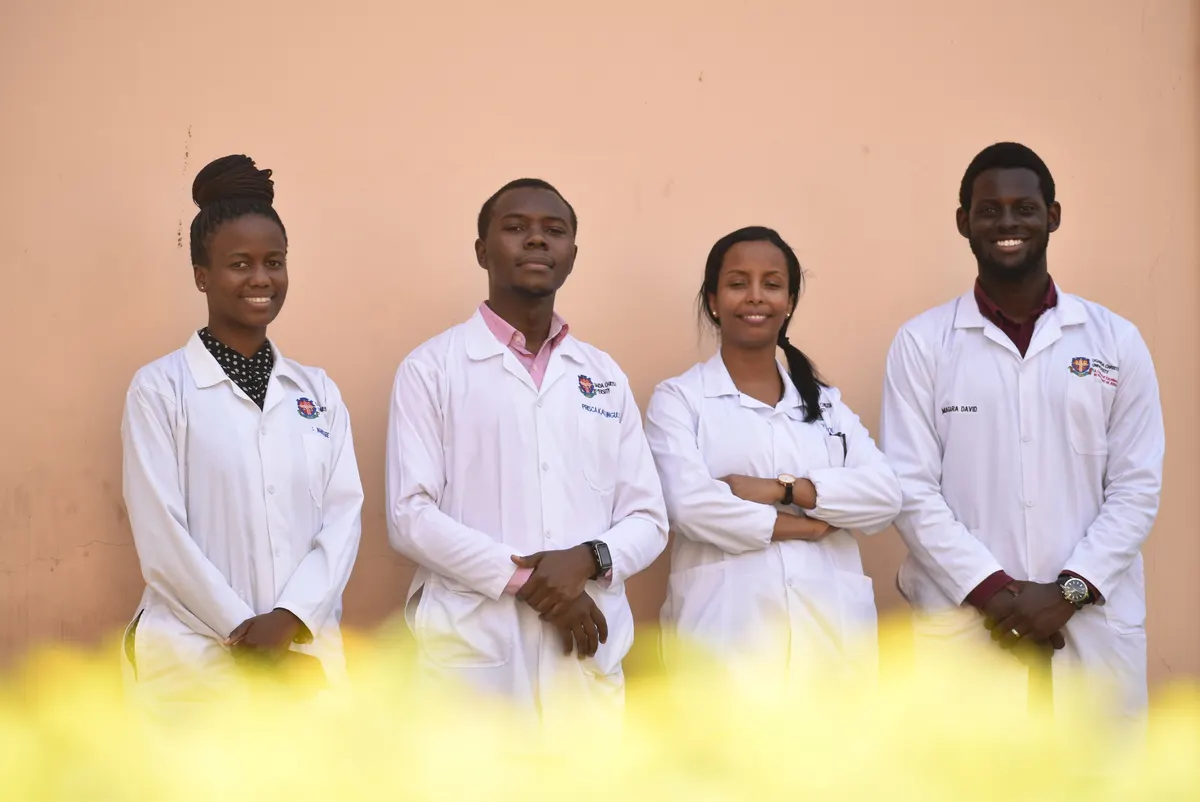 Uganda Christian University students in lab coats
