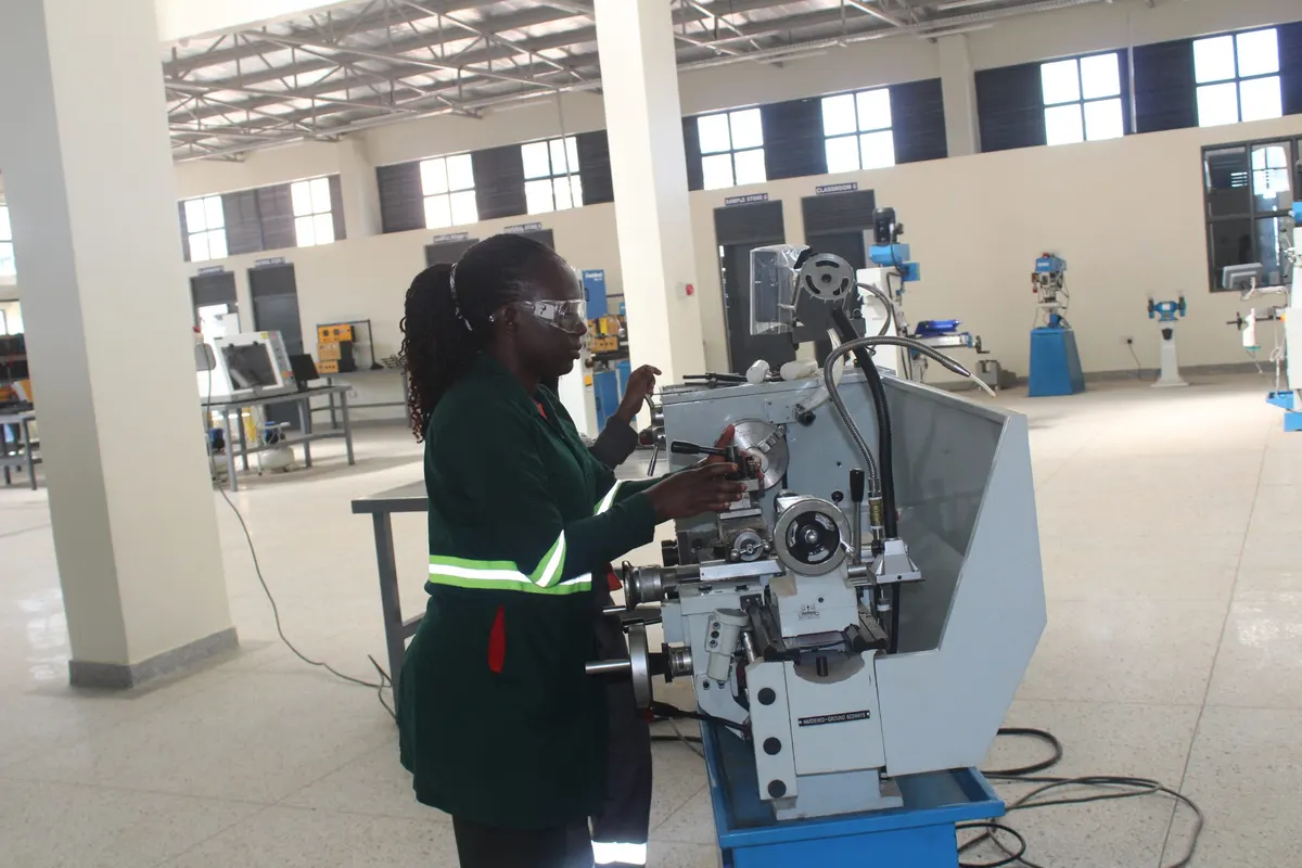 A student operating a machine at UTC Bushenyi