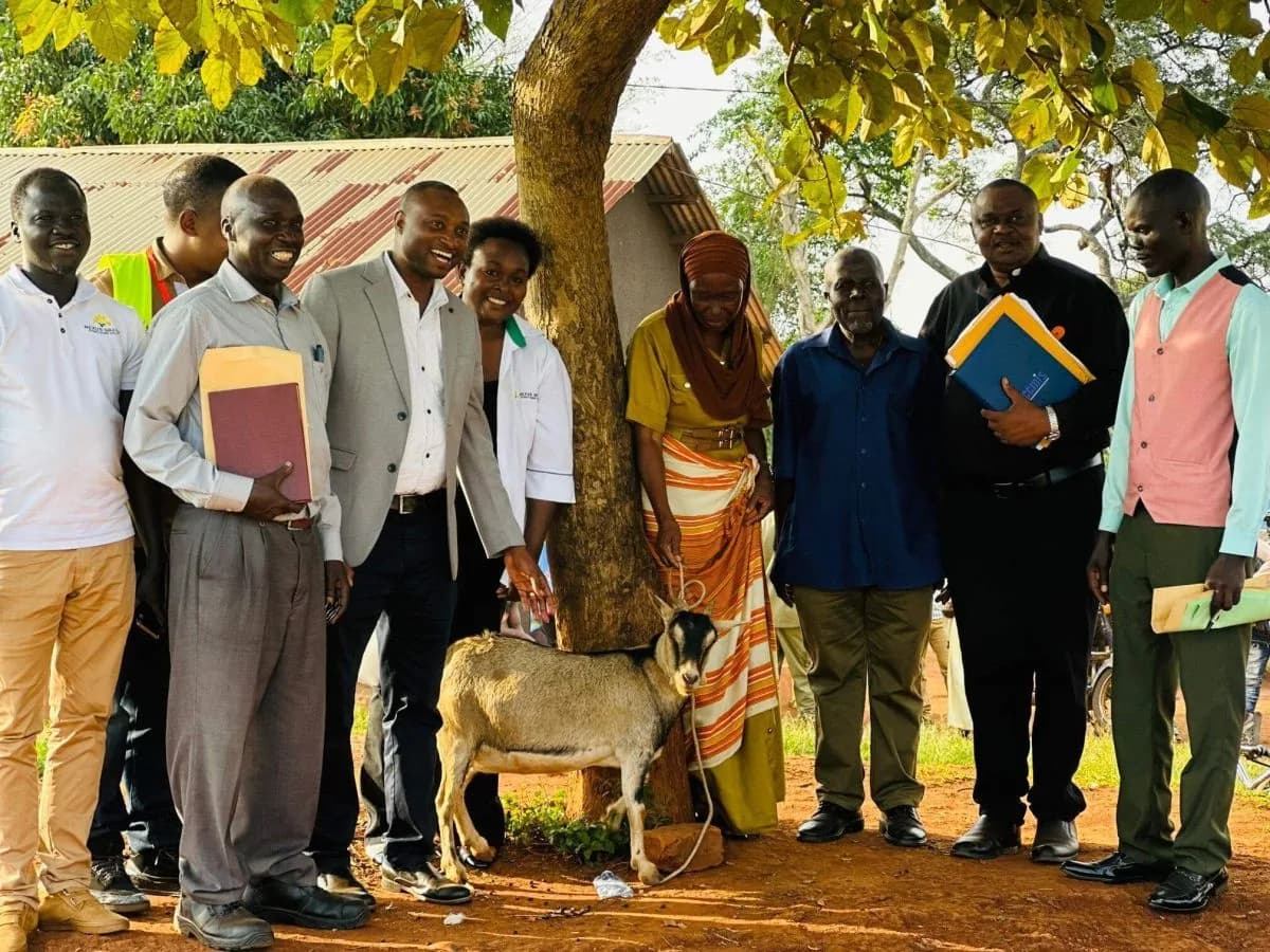 Ministry of Water and Environment representatives with community members at a water programme activity