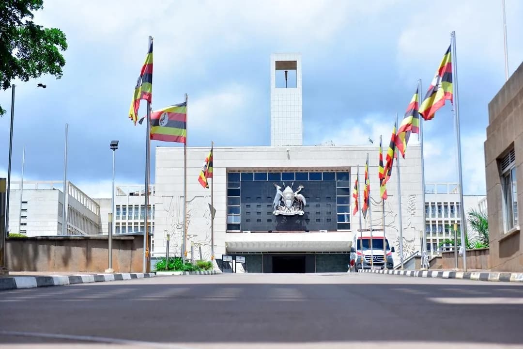 The Parliament of Uganda building in Kampala, lined with Ugandan flags