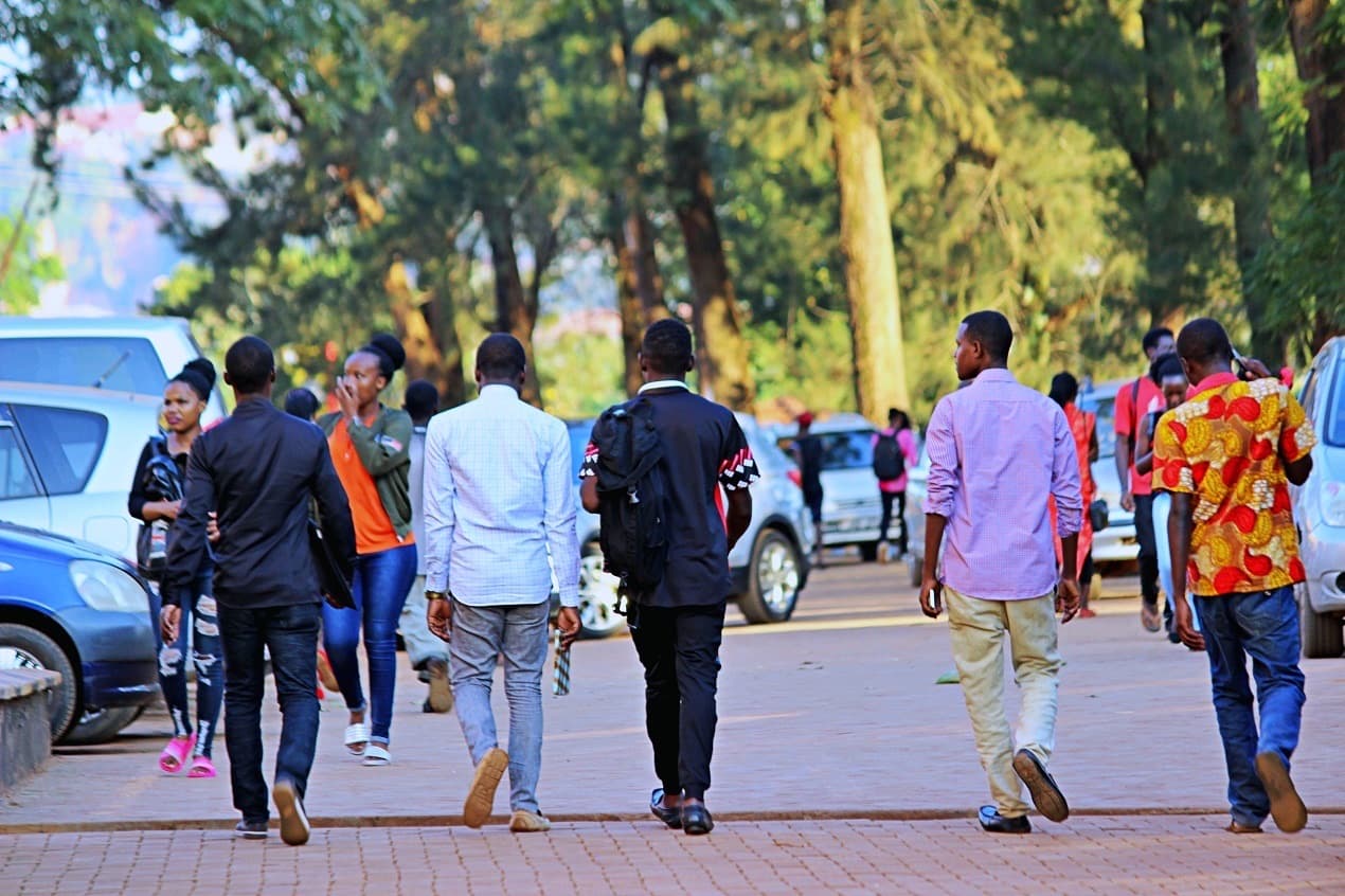 Students walking through the Kyambogo University campus