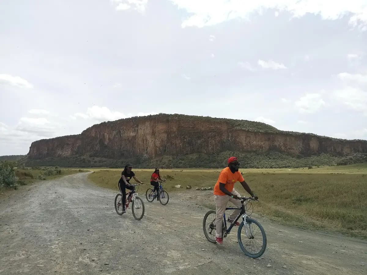 Cyclists riding through Hell's Gate National Park