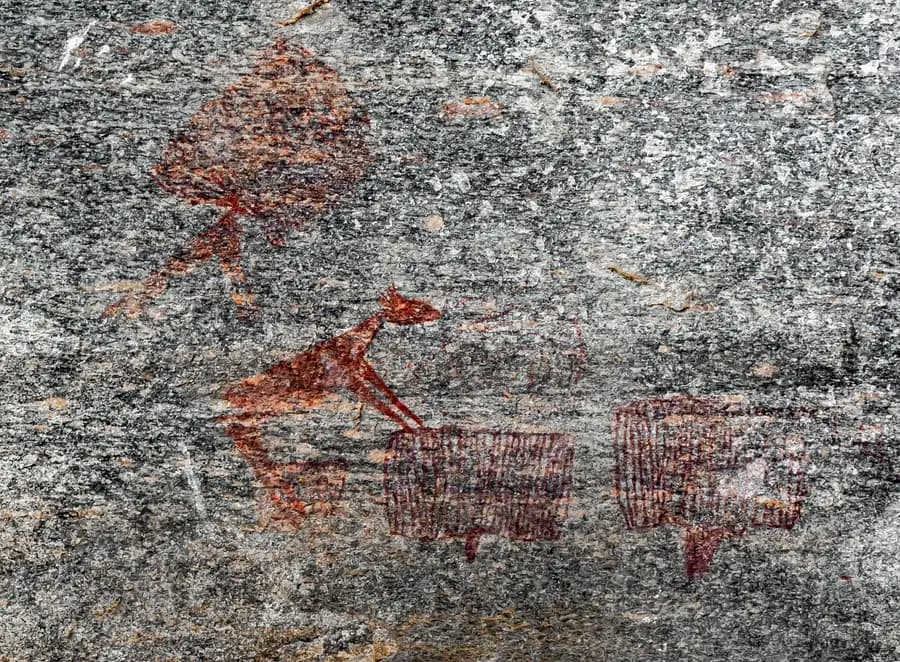 Rock paintings of an animal and figures at Kondoa