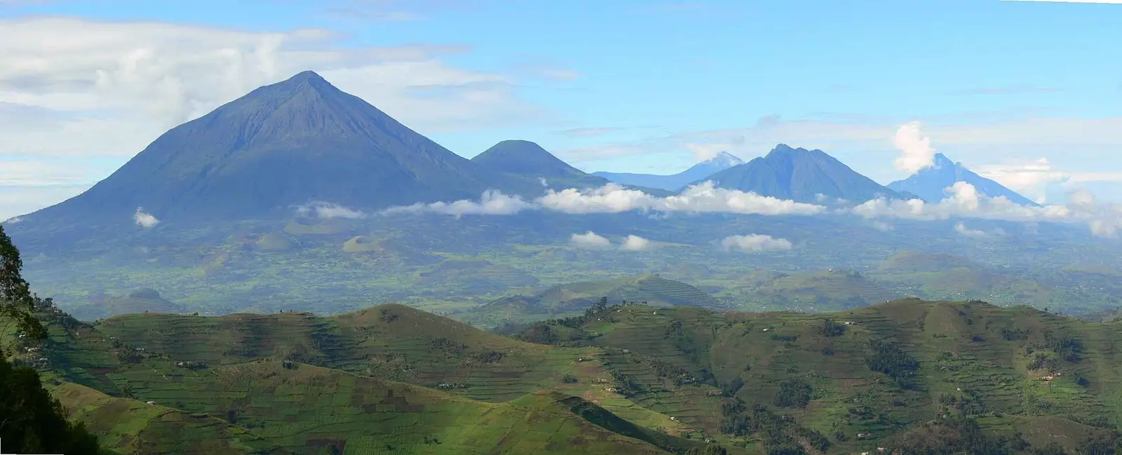 The Virunga volcanoes rising above farmland near Mgahinga