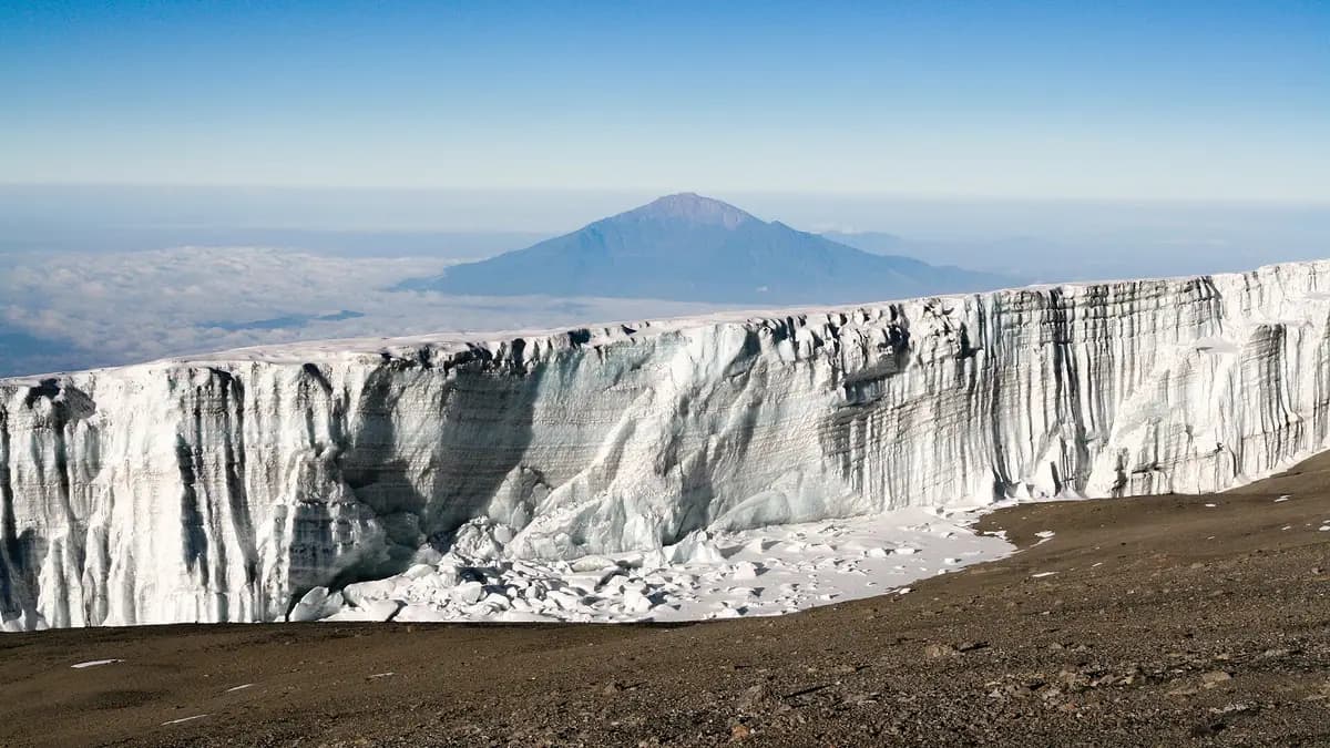 A glacier near Uhuru Peak with Mount Meru in the distance