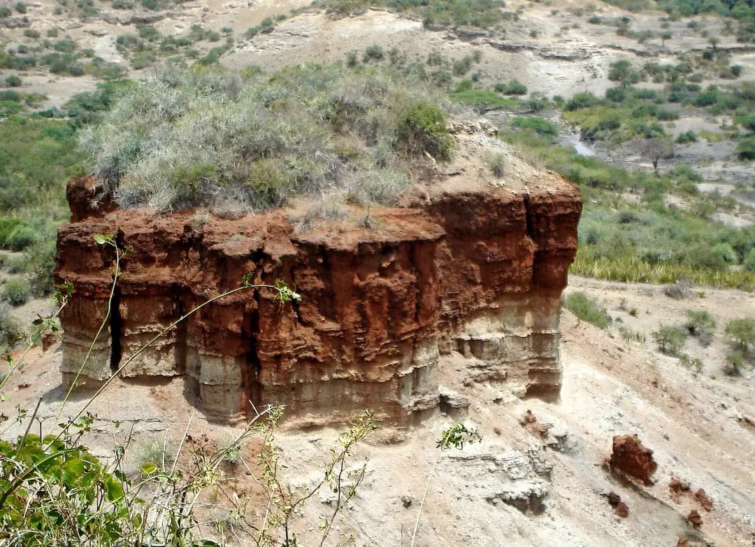 Close view of the layered rock pillar in Olduvai Gorge