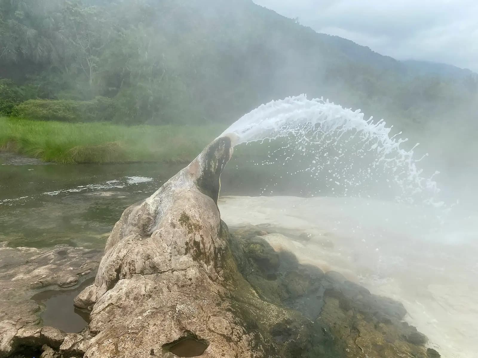 Boiling water spouting from the female hot spring at Sempaya