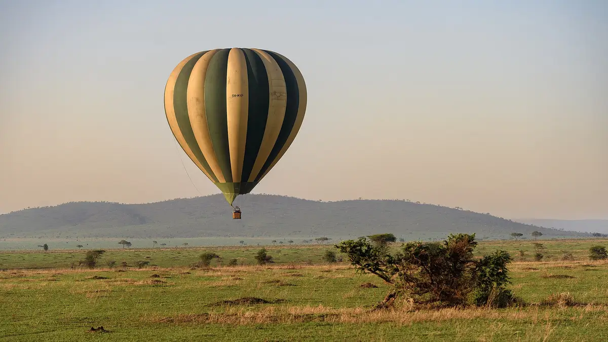 A hot-air balloon drifting over the Serengeti at dawn