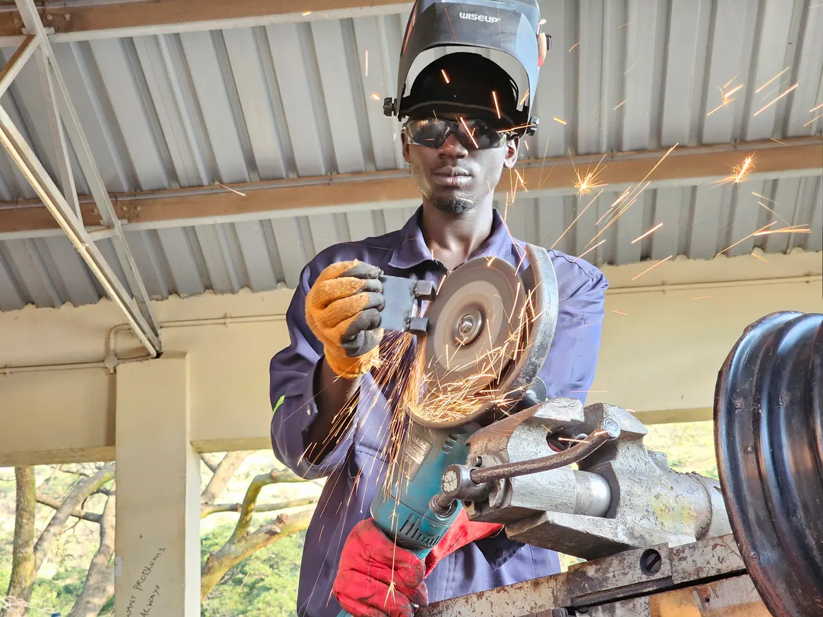 A Busitema University engineering student in a workshop