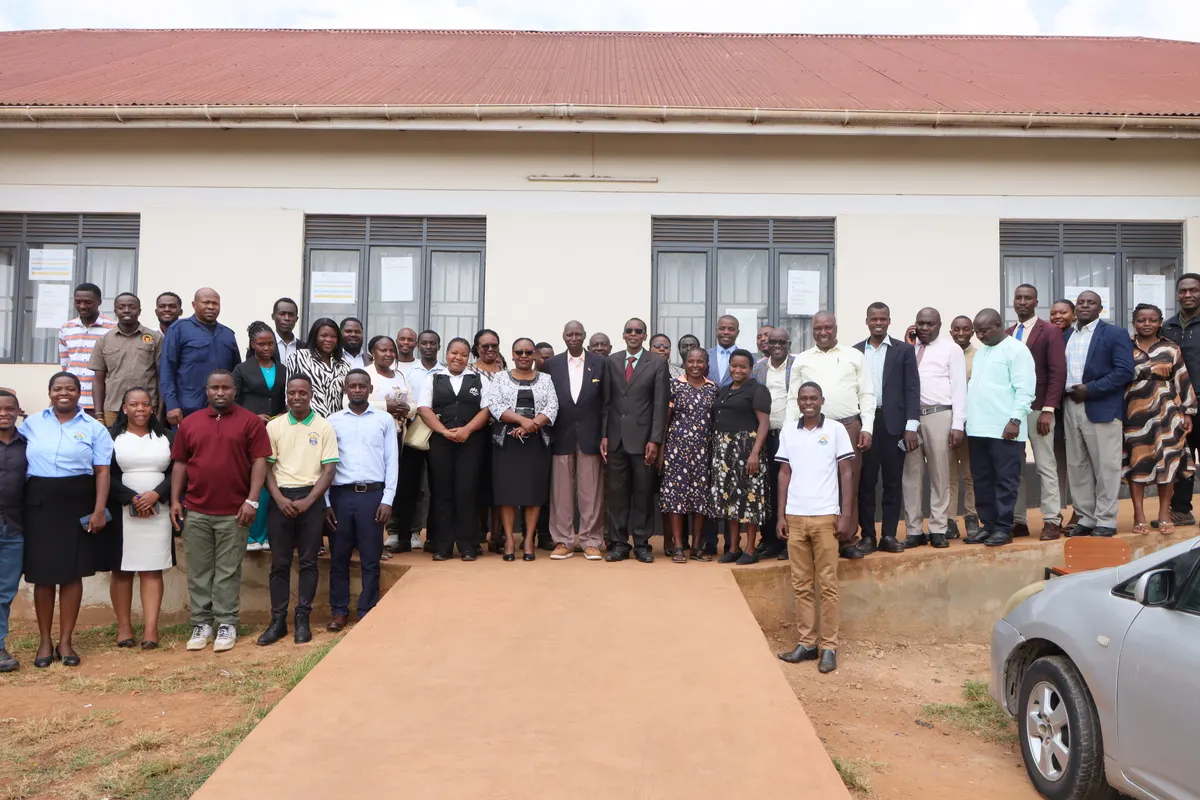 Kabale University staff outside a campus building