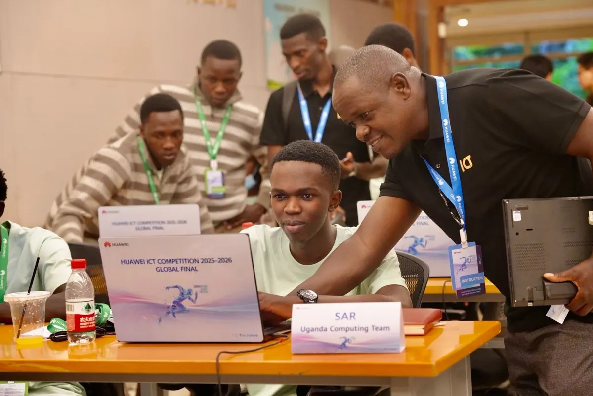 Uganda Martyrs University students working on laptops