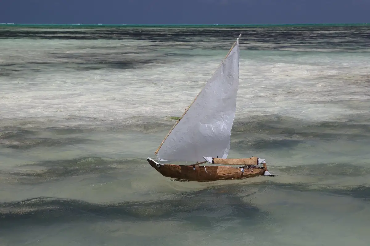 A model sailing dhow racing on the lagoon at Jambiani